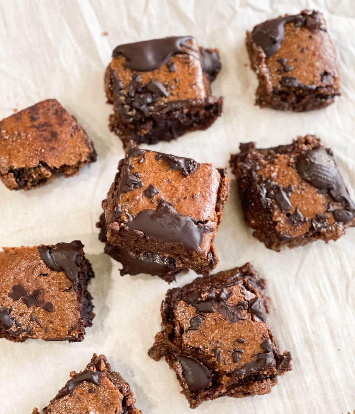 A tray is covered with air fryer vegan brownies. 